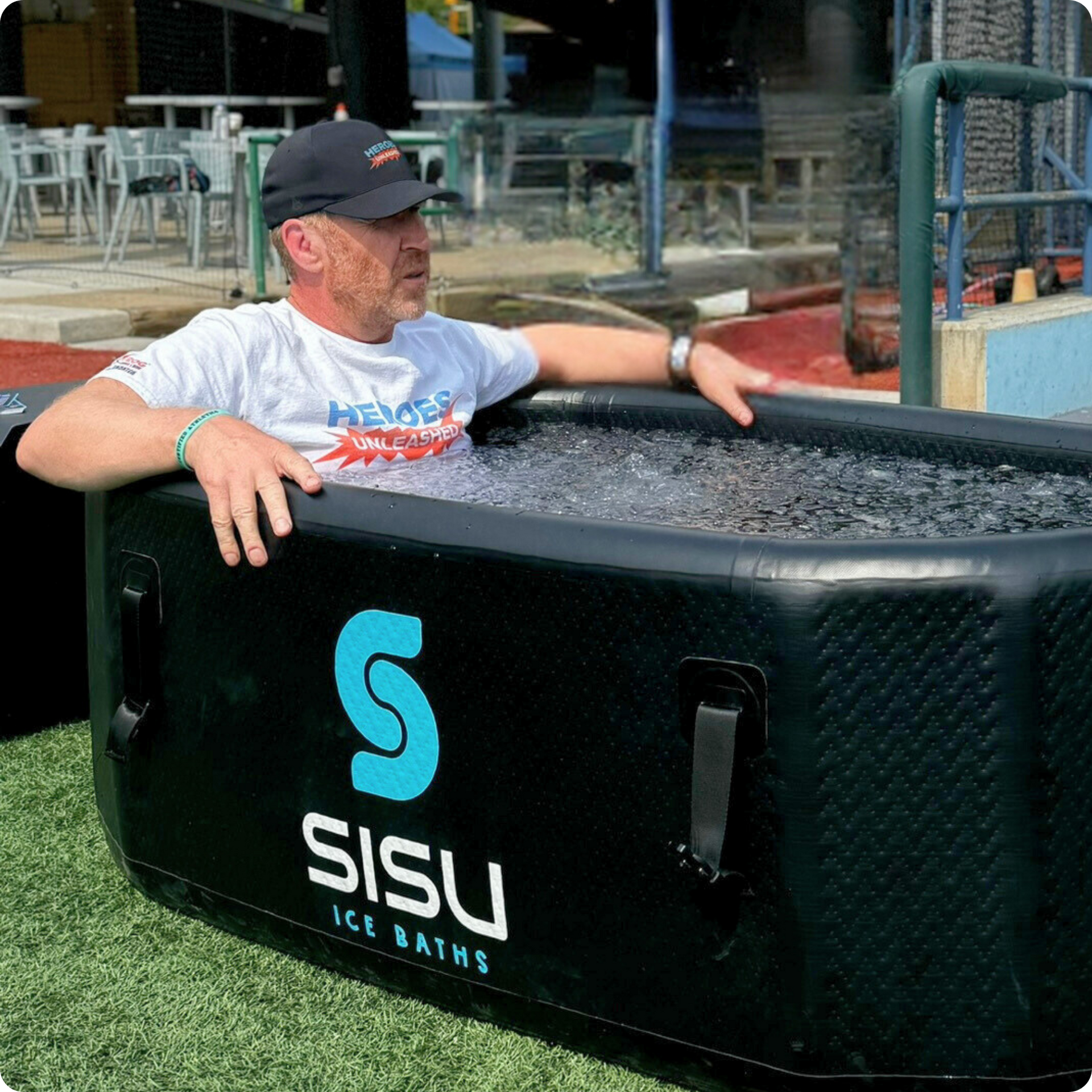 A man immersing himself in the Helsinki Professional Cold Plunge Tub for cold therapy.