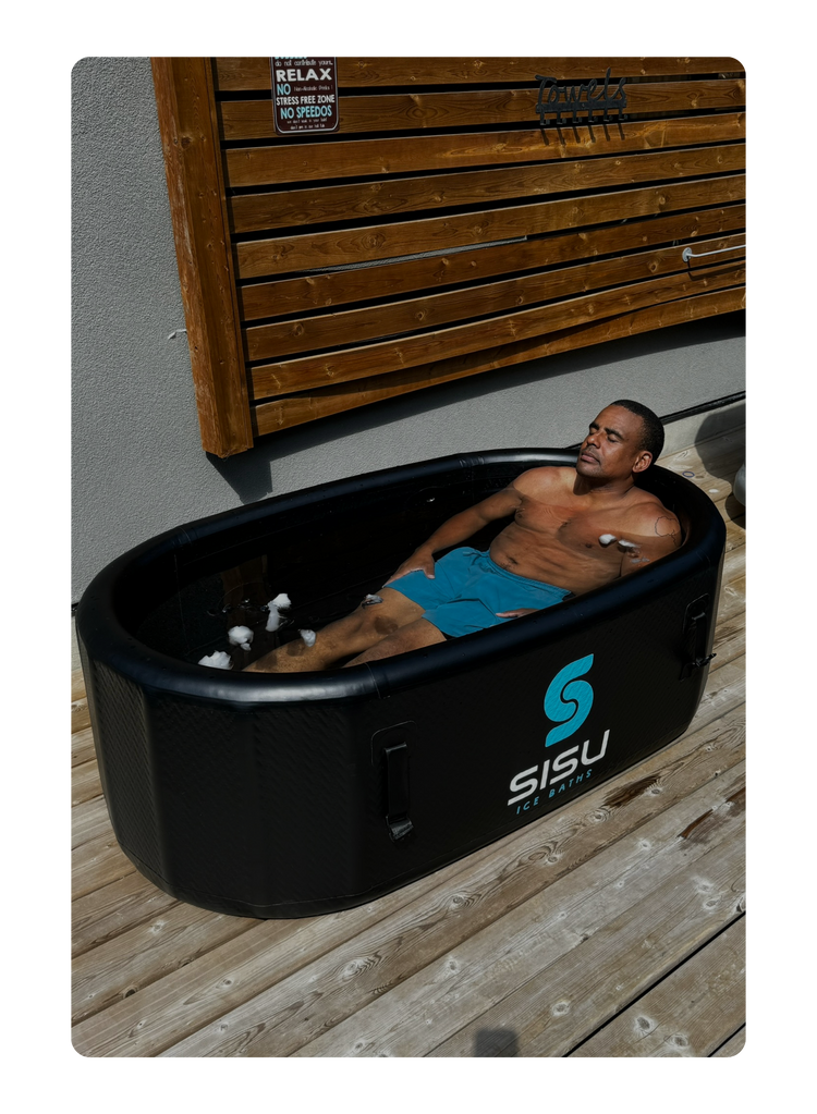 Andre Belibi immerses himself in the Helsinki Professional Cold Plunge Tub for cold therapy.